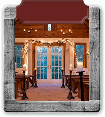 Wooden frame around a photo of a chapel with pews and candle lighting.